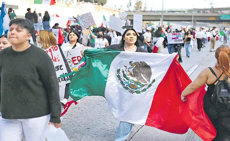 Thousands protest Trump mass deportation plans, block freeway in Los Angeles