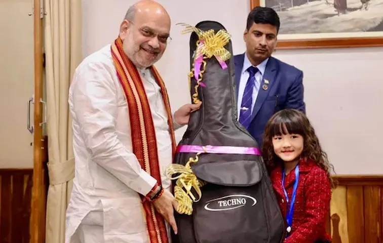 Amit Shah Gifts Guitar To Mizoram's Wonder Kid