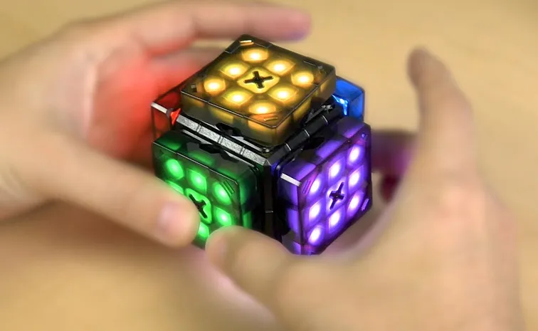 Intelligent Robot Cube scrambles and times itself while teaching beginners how to win