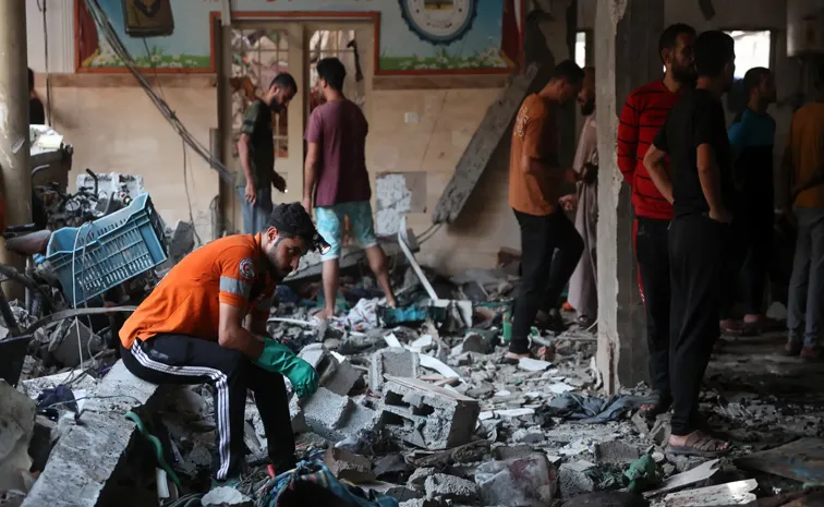 Israeli strike kills dozens sheltering in Gaza school, officials