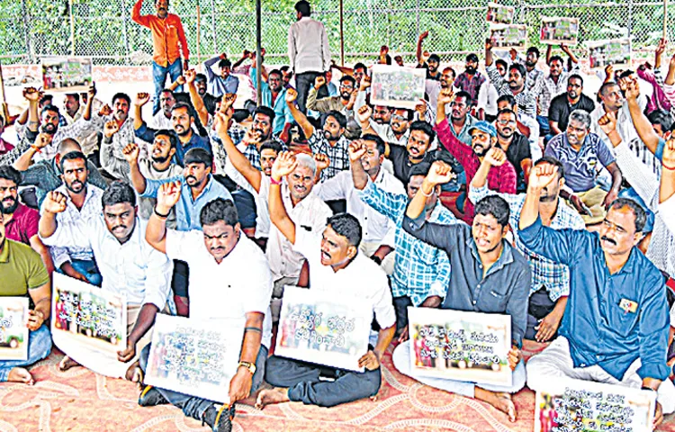 Ration delivery vehicle drivers protest at Dharna Chowk in Vijayawada