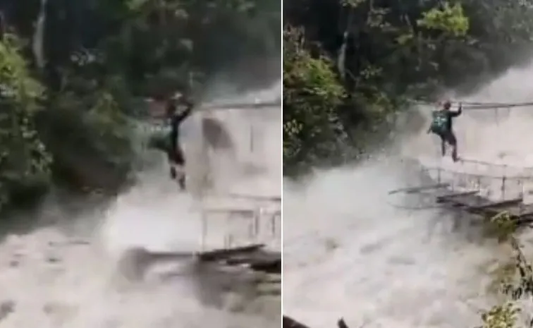 Man Crosses Raging Assam River Using Traditional Hanging Bridge