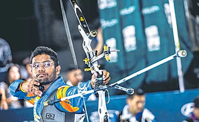 Dheeraj Bommadevara is third with 693 points - Sakshi