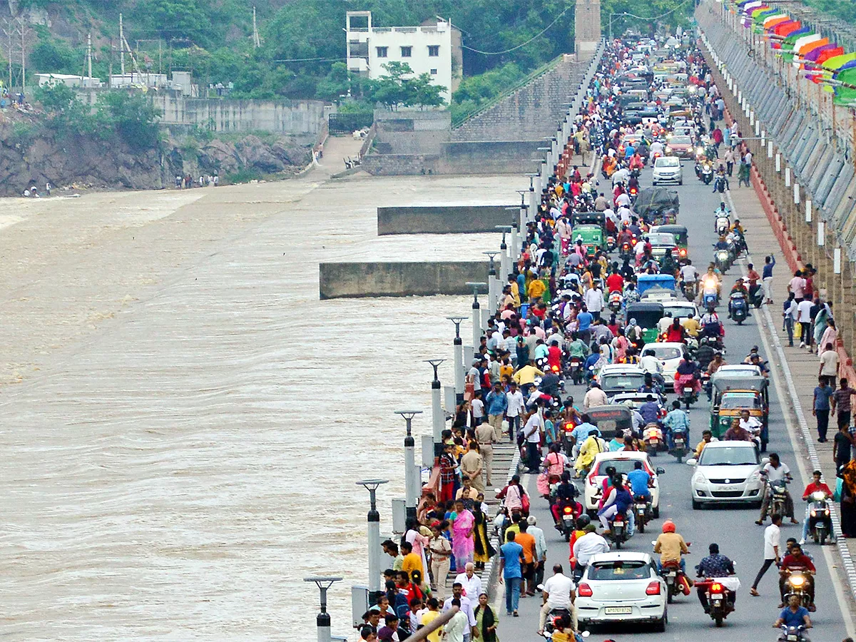 Flood Warning at Prakasam Barrage - Sakshi