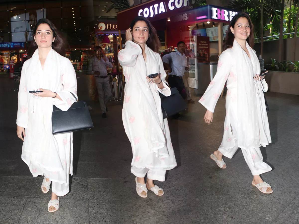 Tamannaah Bhatia Spotted At Mumbai Airport Arrival Photos - Sakshi