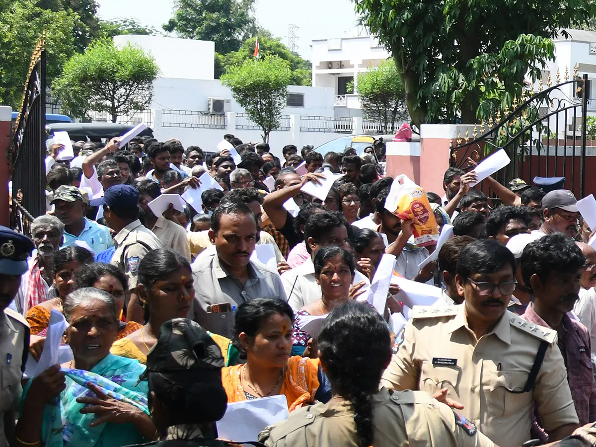 Vijayawada flood victims gathered outside the collector's office photo gallery. [node:summary]